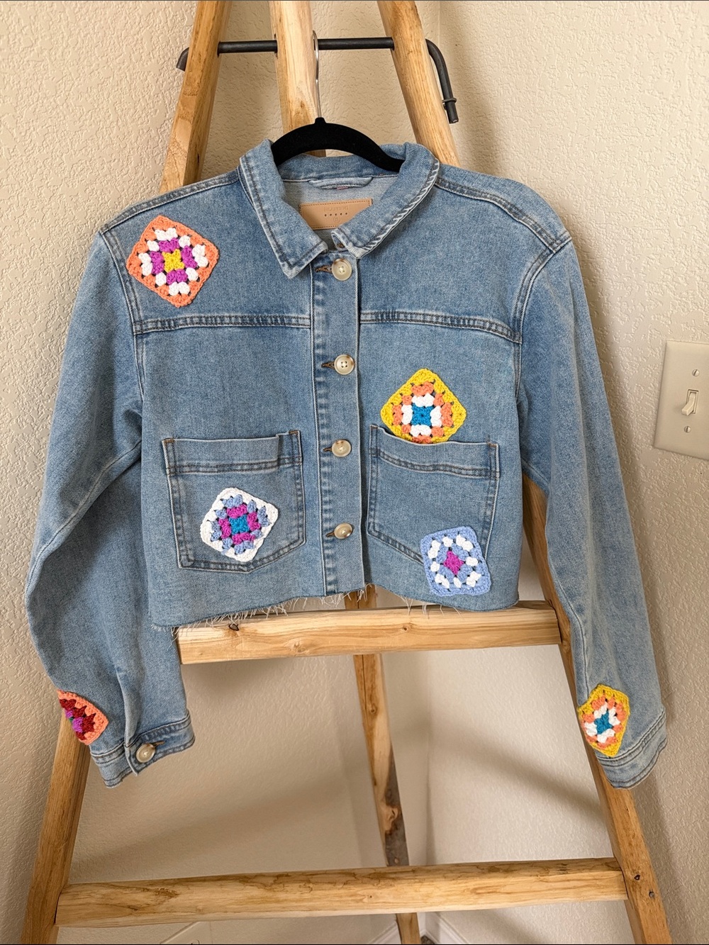 Blank NYC Light Blue Denim Jacket with Multicolor Crochet Patches